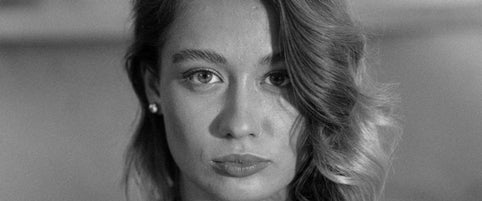 Black and white editorial close-up of Loretana model wearing sterling silver stud earring profile. Hand-finished hallmarked 925 silver, Kaunas.