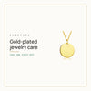 How Do You Care for Gold-Plated Jewelry? Loretana cover with the 14k gold engraved coin necklace.