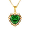 Green CZ Heart Necklace in 14K gold-plated 925 silver: a heart-cut green AAAAA cubic zirconia bordered with white stones, on white.