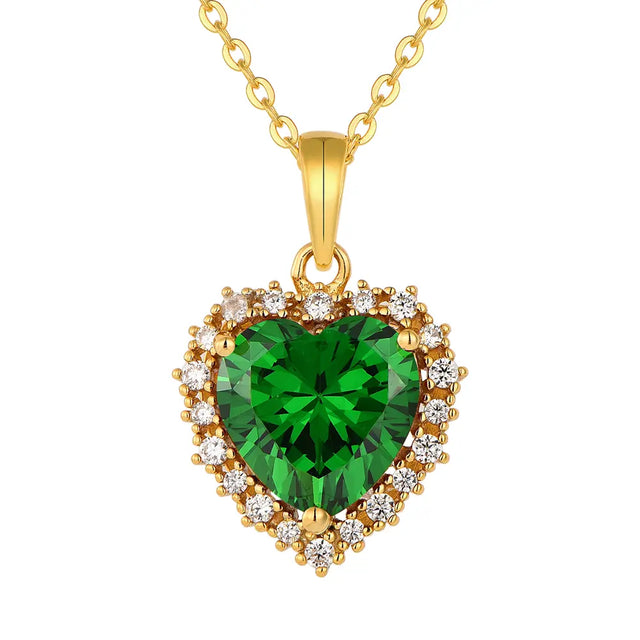 14K Gold Emerald Heart Necklace in 925 sterling silver displayed on a white background to highlight the vibrant green heart pendant.