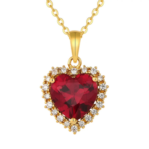 Close up of the 14K Gold Ruby Heart Necklace highlighting the precision-cut AAAAA ruby red zirconia and the polished 14K gold-plated setting.