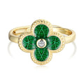 Hand wearing the green four leaf clover ring in 14K gold-plated 925 silver with green AAAAA cubic zirconia.