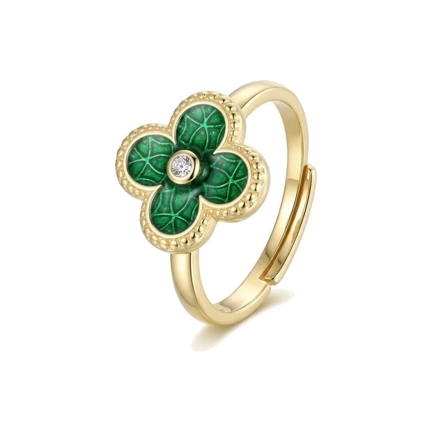 Green clover ring in 14K gold-plated 925 silver with an adjustable band and one clear cubic zirconia at the centre, on white