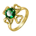 Interchangeable Stone Heart Ring in 14K gold-plated 925 silver with a green AAAAA cubic zirconia stone, on white.