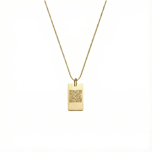 Close up of 14K gold square pendant showing precision laser engraving surface