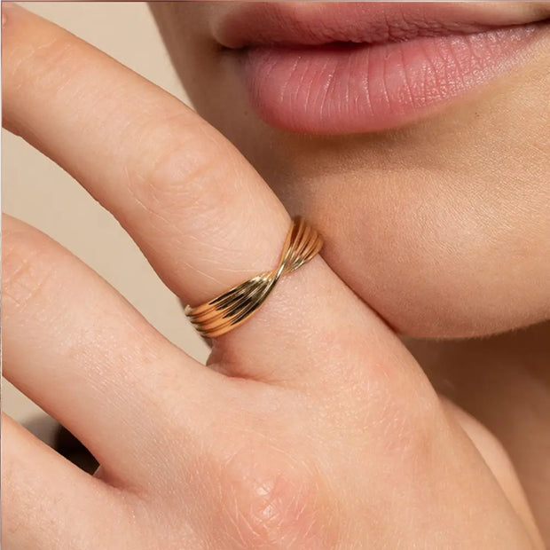 Close-up of the 14K gold twisted knot ring highlighting the pure metal texture.