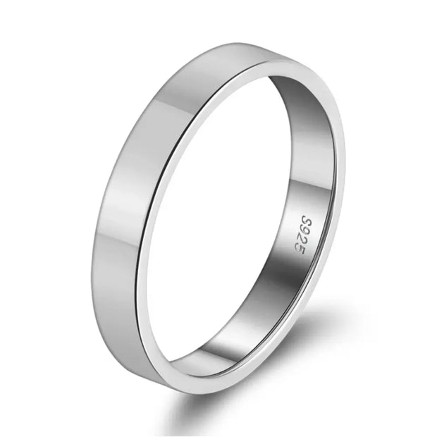 Close-up of the thin silver stacking ring highlighting the polished 3mm engravable band.