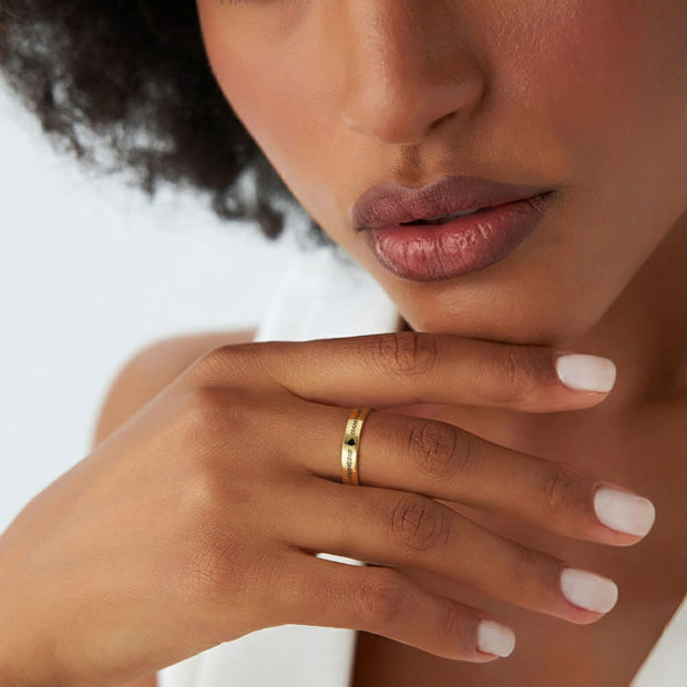Close-up of a woman's hand wearing the personalized 3mm silver stacking ring