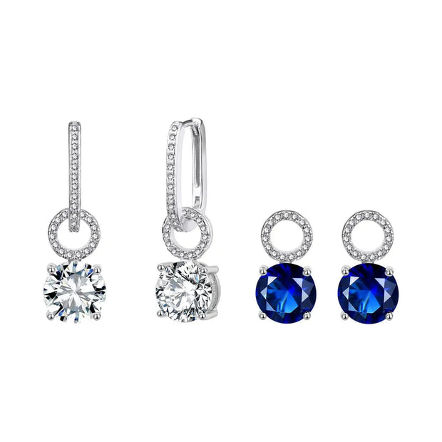Interchangeable silver hoops with their two drop sets, white and deep blue AAAAA cubic zirconia, on white.