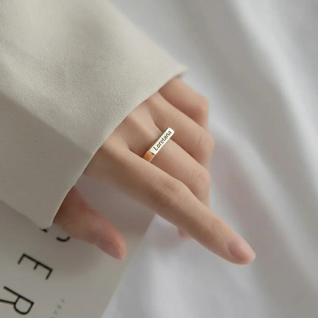 Close-up of the silver rectangle ring highlighting the open-back adjustable band.