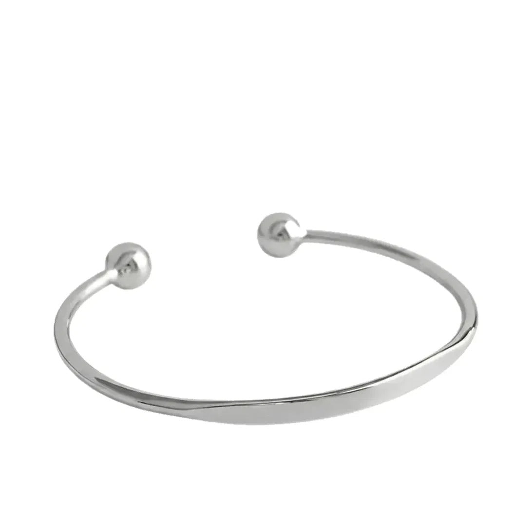 Personalized Letter Bangle in 925 sterling silver, an open cuff with ball ends and a flat engravable front, on white
