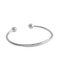 Personalized Letter Bangle in 925 sterling silver, an open cuff with ball ends and a flat engravable front, on white