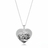 Close-up of the 925 sterling silver heart pendant with a photograph laser engraved onto the polished surface.