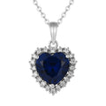 Blue CZ Heart Necklace in 925 silver: a heart-cut deep blue AAAAA cubic zirconia bordered with white stones, on white.
