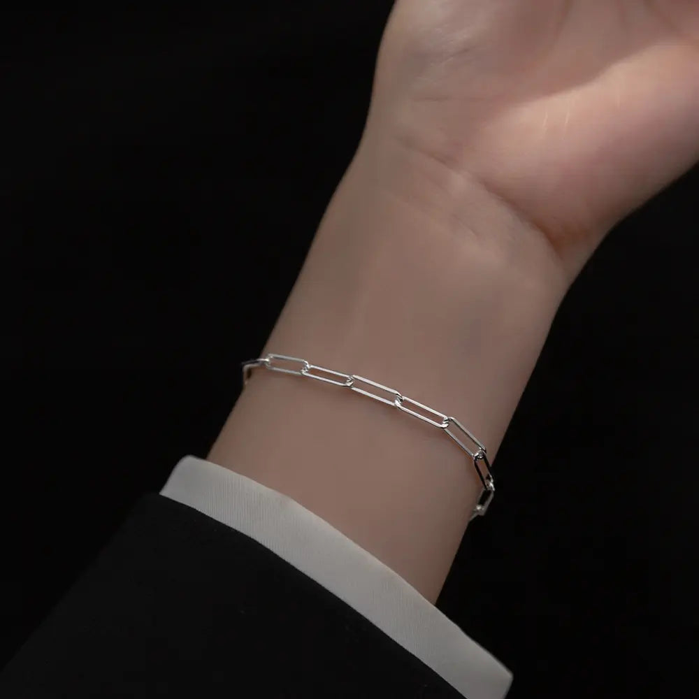 Close up of 925 silver paperclip bracelet showing precision elongated link geometry
