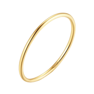 Close-up of a woman's hand wearing multiple 14K gold-plated essential bands for a modern look