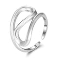 Close-up of the silver geometric ring highlighting the open-back adjustable band and sleek lines.