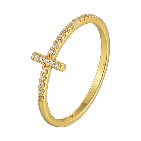 Hand model wearing the gold cross zirconia ring in 925 sterling silver with 14K gold plating, narrow cross motif sitting flat against the finger in soft light. Hallmarked Loretana piece, hand-finished in Kaunas.