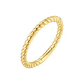 Hand wearing the 14K gold-plated twisted rope band stacked with other rings, showing the cabled 925 silver texture.