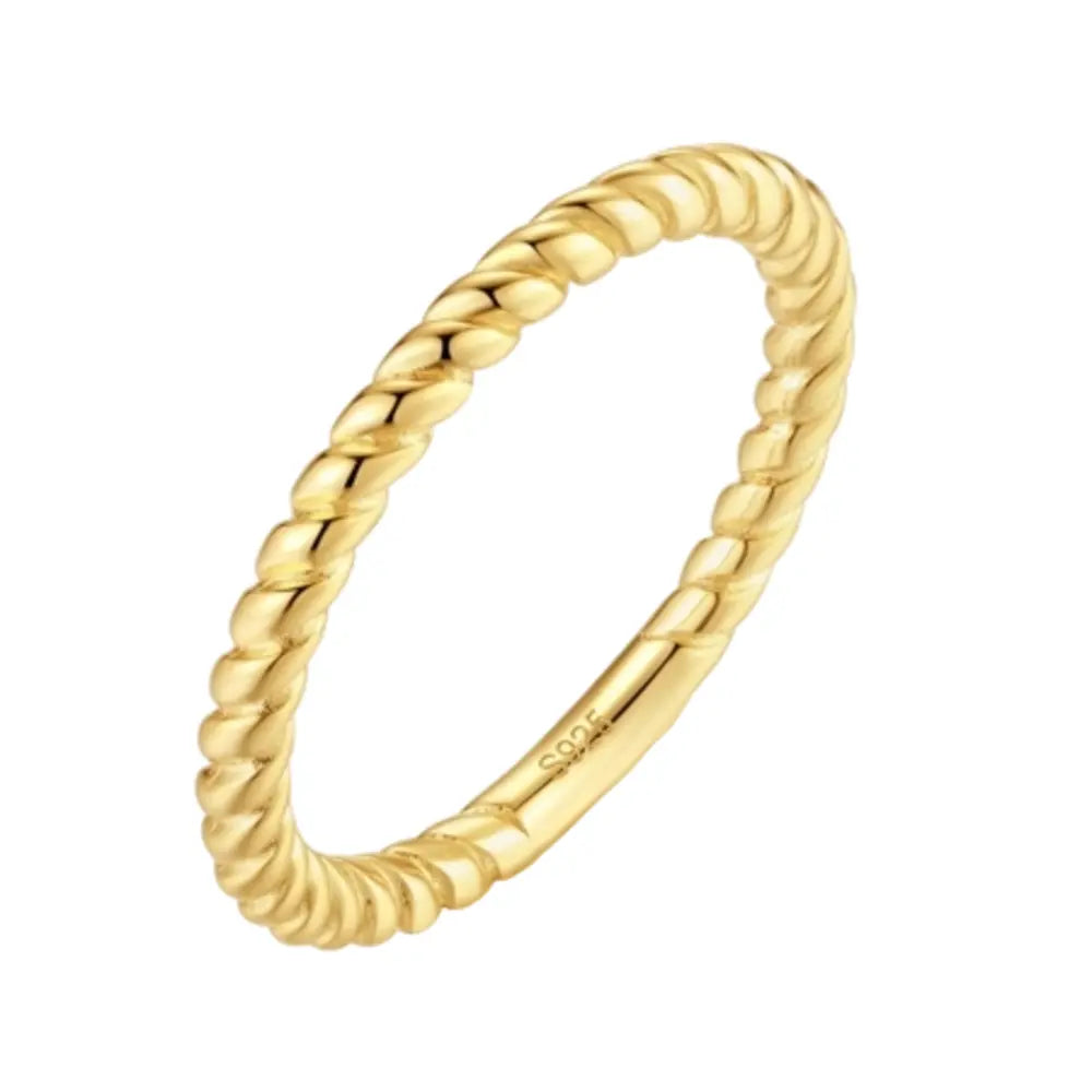Close-up of a woman's hand wearing the 14K gold-plated twisted rope band for a stackable look.