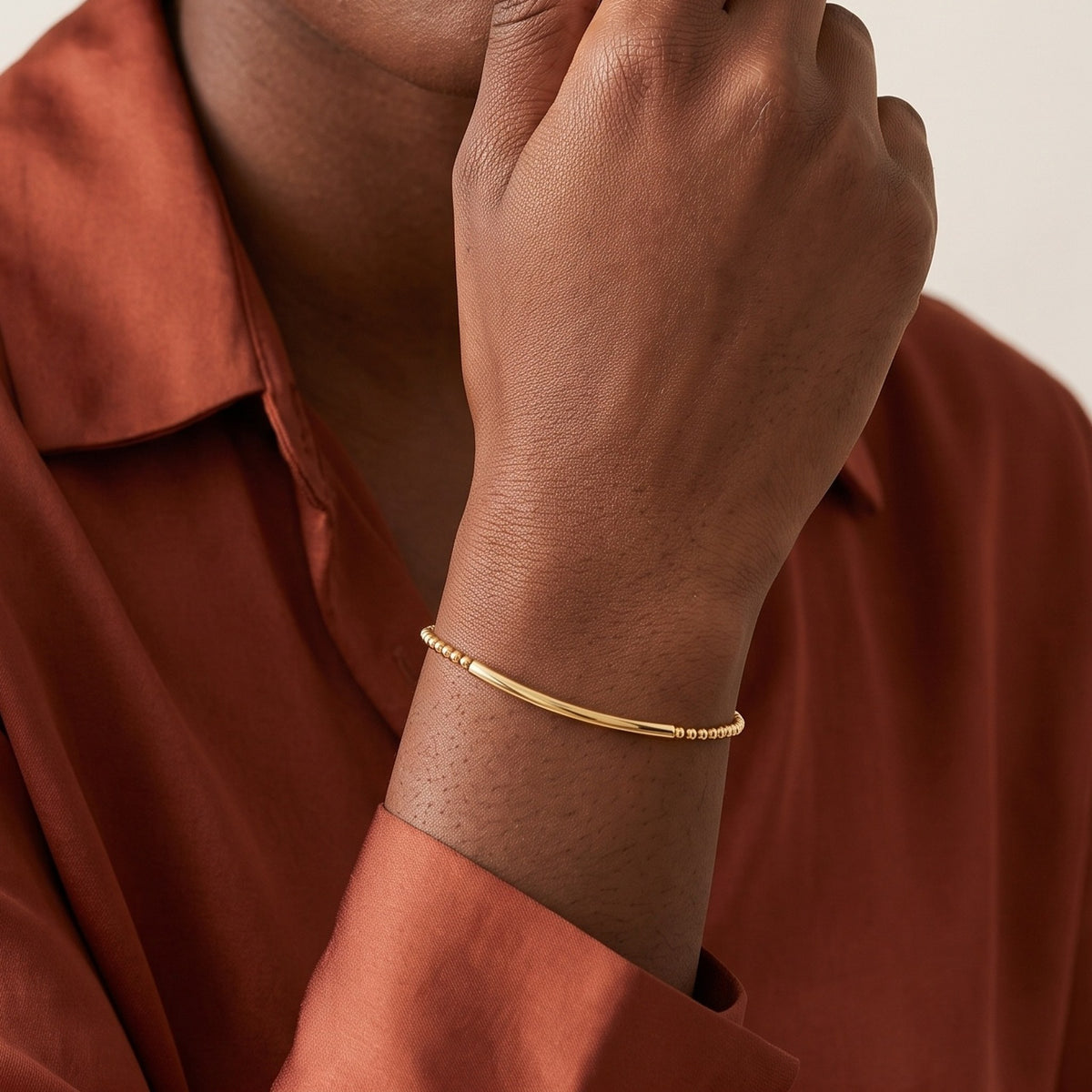 Close-up of the Bead Bar Bracelet in 14K gold-plated 925 sterling silver, worn