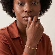 Model wearing the Bead Bar Bracelet in 14K gold-plated 925 sterling silver
