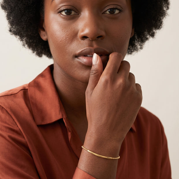 Model wearing the Bead Bar Bracelet in 14K gold-plated 925 sterling silver