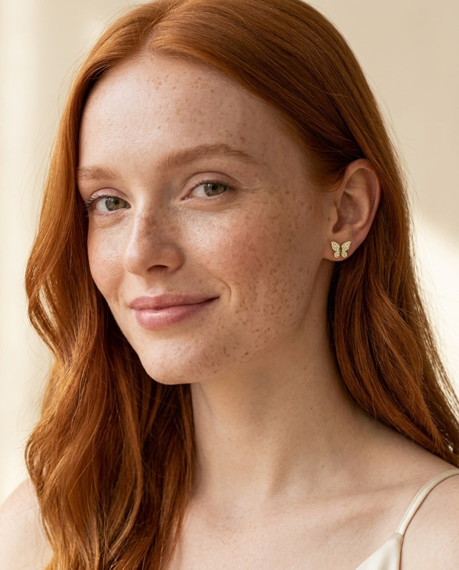 Model wearing the Butterfly Pave Studs, AAAAA CZ in 14K gold-plated 925 sterling silver