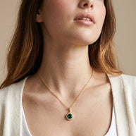 Model wearing the Green CZ Halo Necklace in 14K gold-plated 925 sterling silver, second view