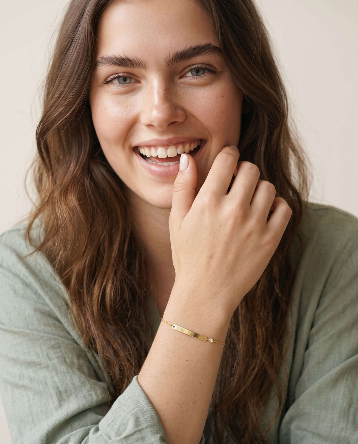 Model wearing the Engraved Curved Bar Bracelet, CZ in 14K gold-plated 925 sterling silver, second view