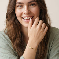 Model wearing the Engraved Curved Bar Bracelet, CZ in 14K gold-plated 925 sterling silver, second view