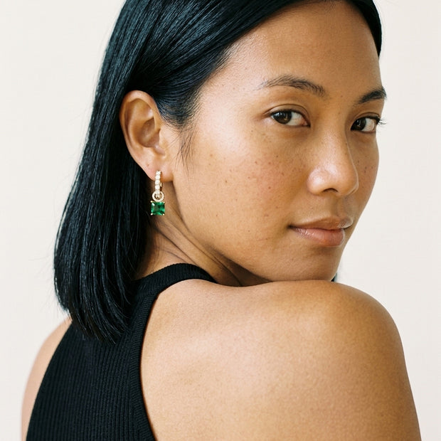 Model wearing the Interchangeable Halo Hoops, Green CZ in 14K gold-plated 925 sterling silver