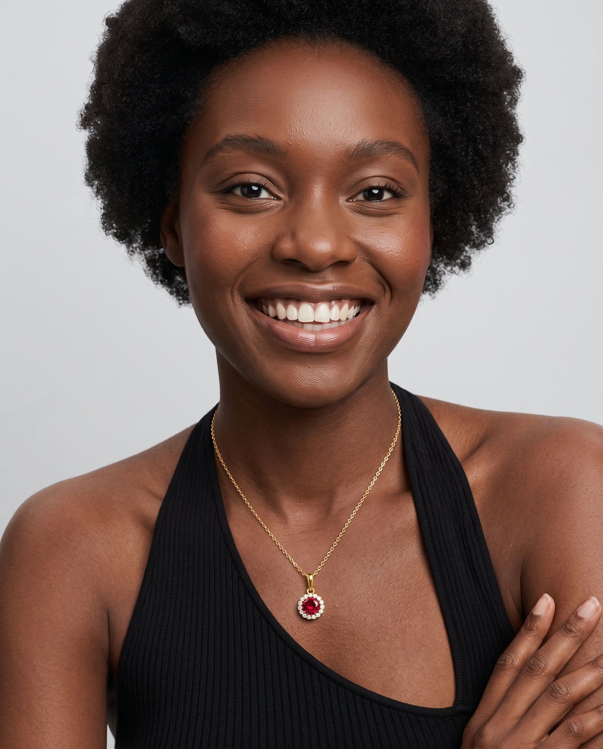 Model wearing the Red CZ Halo Necklace in 14K gold-plated 925 sterling silver