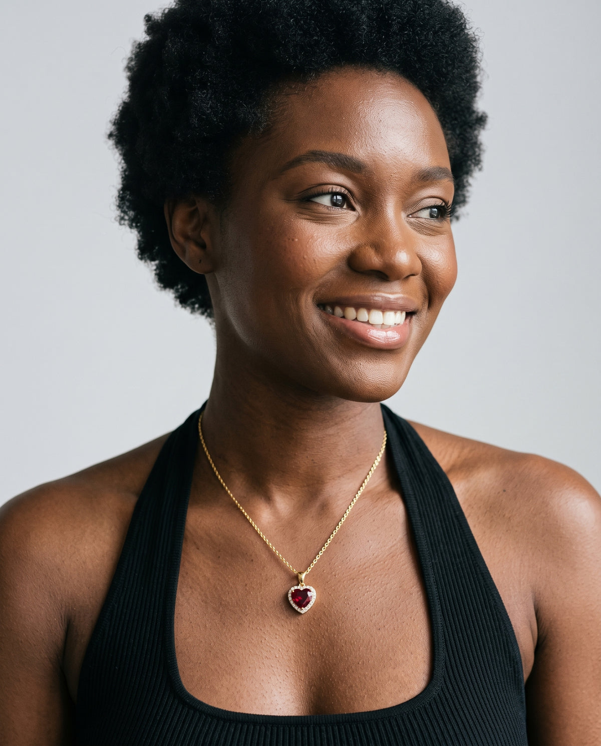 Model wearing the Red CZ Heart Necklace in 14K gold-plated 925 sterling silver