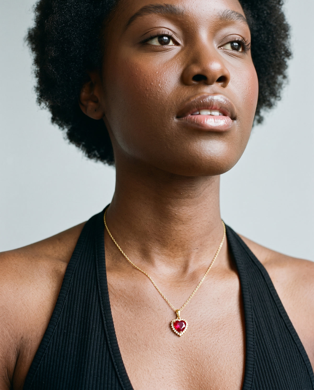 Model wearing the Red CZ Heart Necklace in 14K gold-plated 925 sterling silver, second view