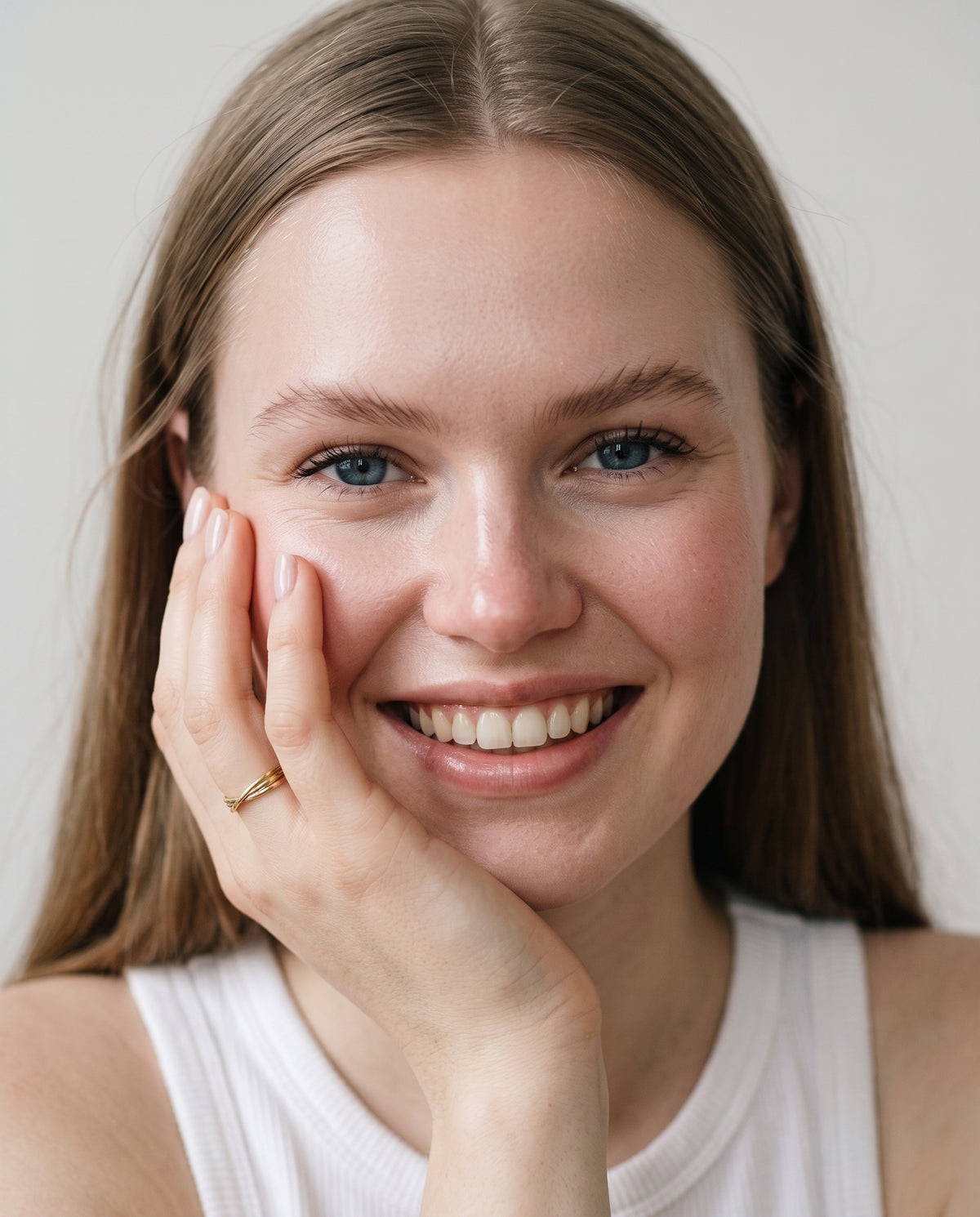 Model wearing the Twisted Knot Stacking Ring in 14K gold-plated 925 sterling silver