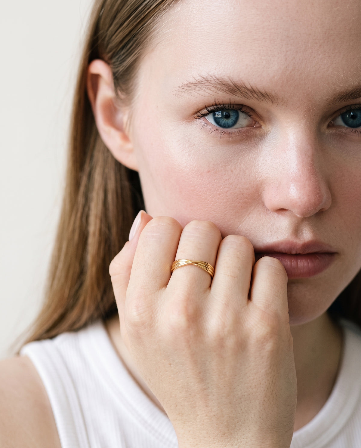 Model wearing the Twisted Knot Stacking Ring in 14K gold-plated 925 sterling silver, second view