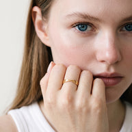 Model wearing the Twisted Knot Stacking Ring in 14K gold-plated 925 sterling silver, second view