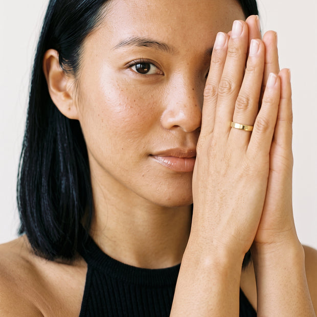 Model wearing the Engravable Stacking Ring 3mm in 14K gold-plated 925 sterling silver