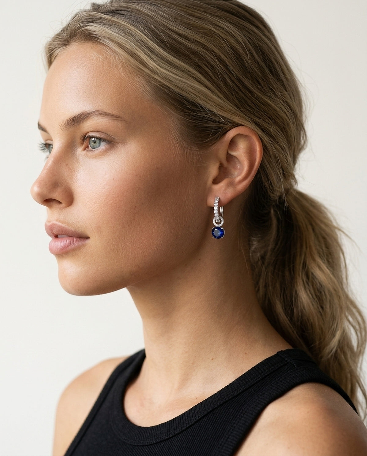 Model wearing the Interchangeable Halo Hoops, Blue CZ in 925 sterling silver, second view