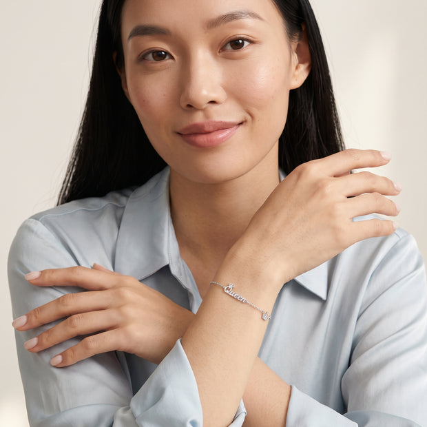 Model wearing the Crown Initial Bracelet in 925 sterling silver