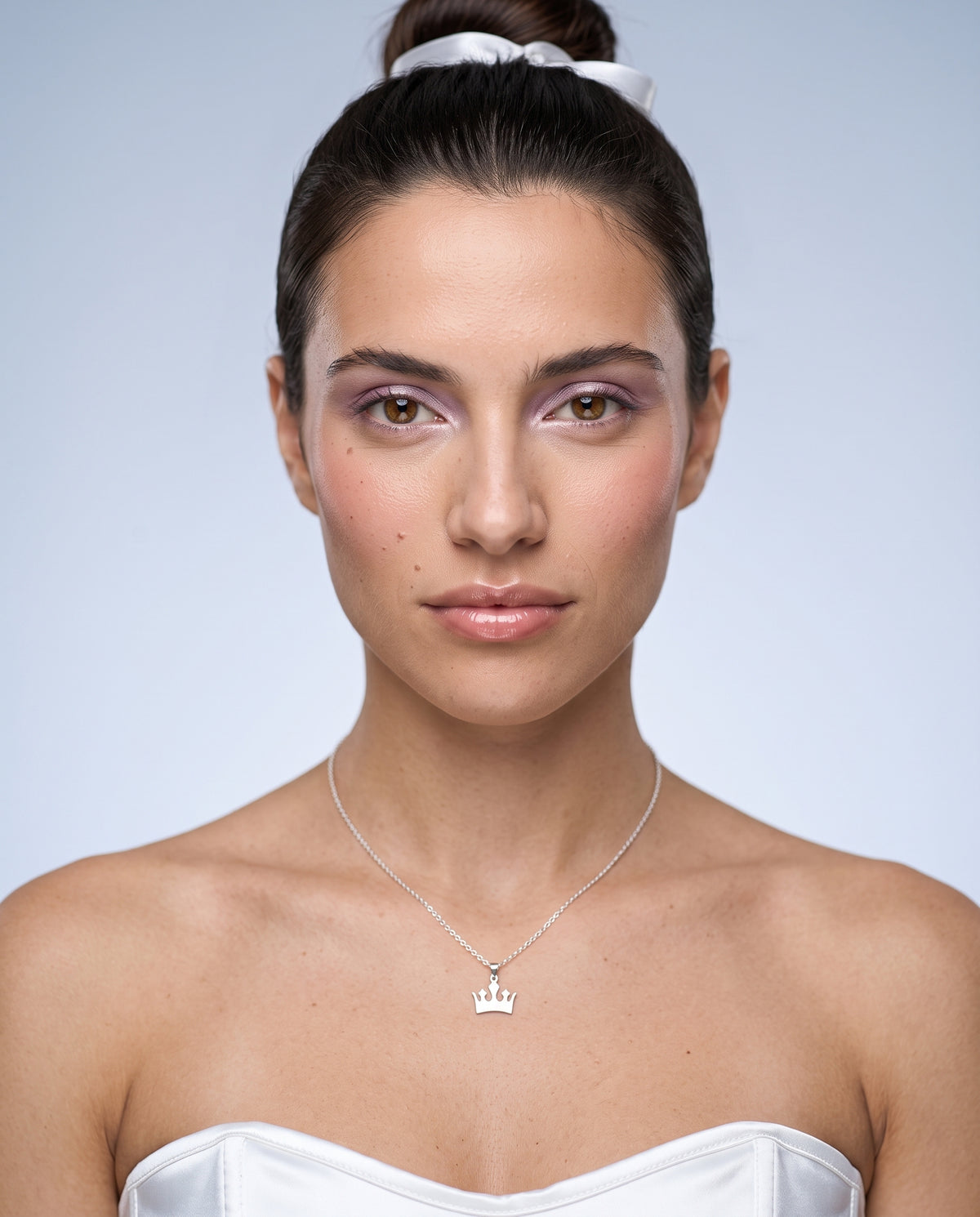 Model wearing the Crown Pendant Necklace in 925 sterling silver