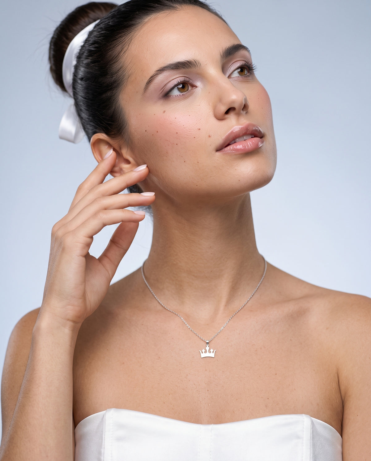 Model wearing the Crown Pendant Necklace in 925 sterling silver, second view
