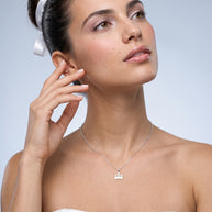 Model wearing the Crown Pendant Necklace in 925 sterling silver, second view