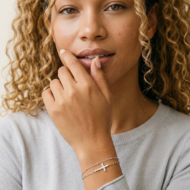 Model wearing the Double Layer Cross Bracelet in 925 sterling silver