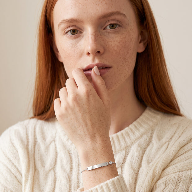 Model wearing the Engraved Curved Bar Bracelet, CZ in 925 sterling silver