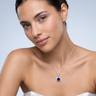 Model wearing the Blue CZ Halo Necklace in 925 sterling silver