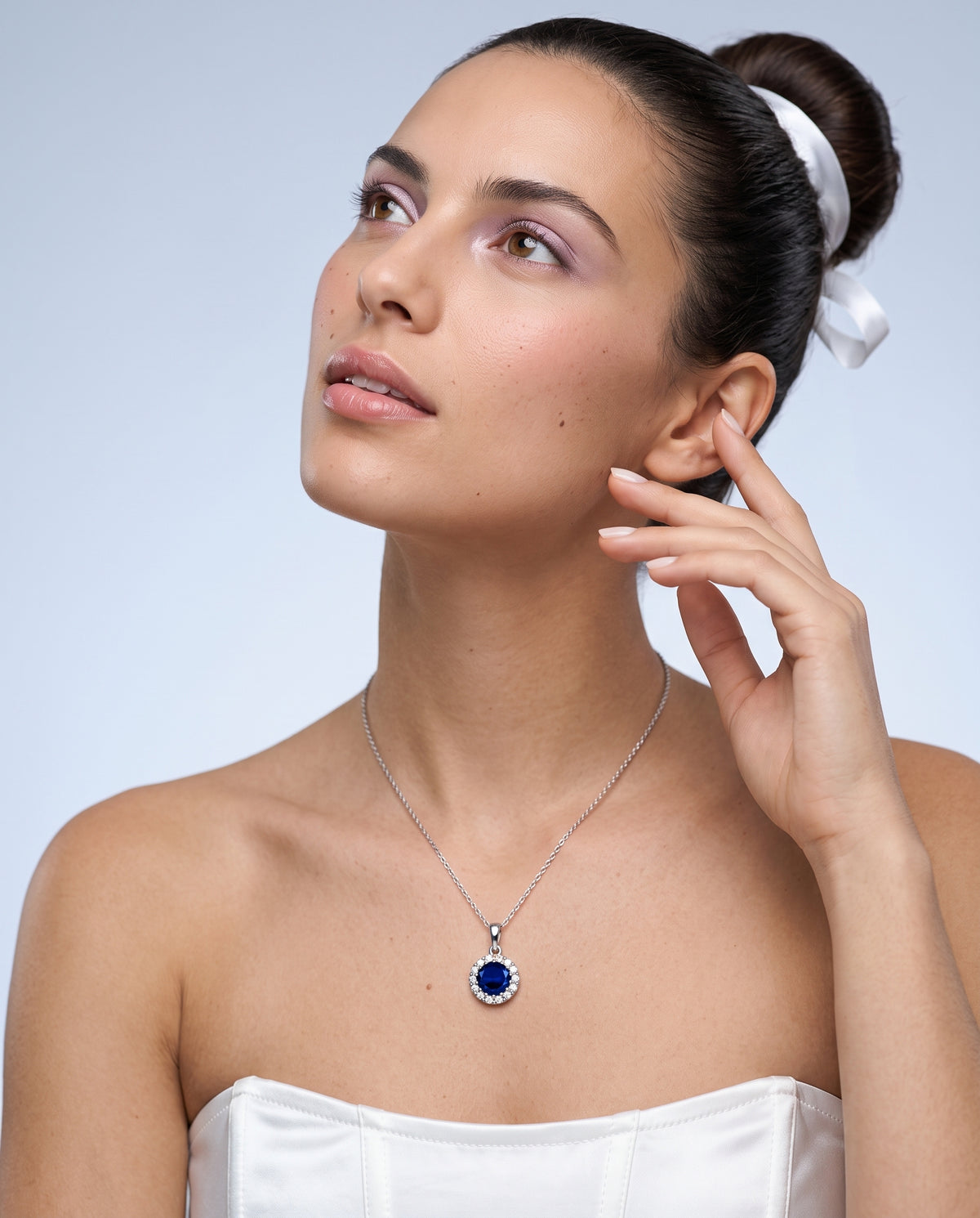 Model wearing the Blue CZ Halo Necklace in 925 sterling silver, second view