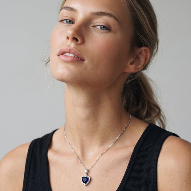 Model wearing the Blue CZ Heart Necklace in 925 sterling silver