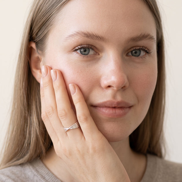 Model wearing the Twisted Knot Stacking Ring in 925 sterling silver